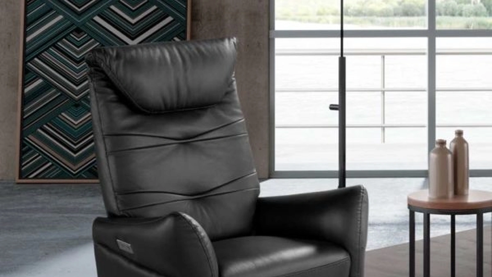 Poltrona relax in pelle con base in metallo Adrian Swivel di Spaziorelax