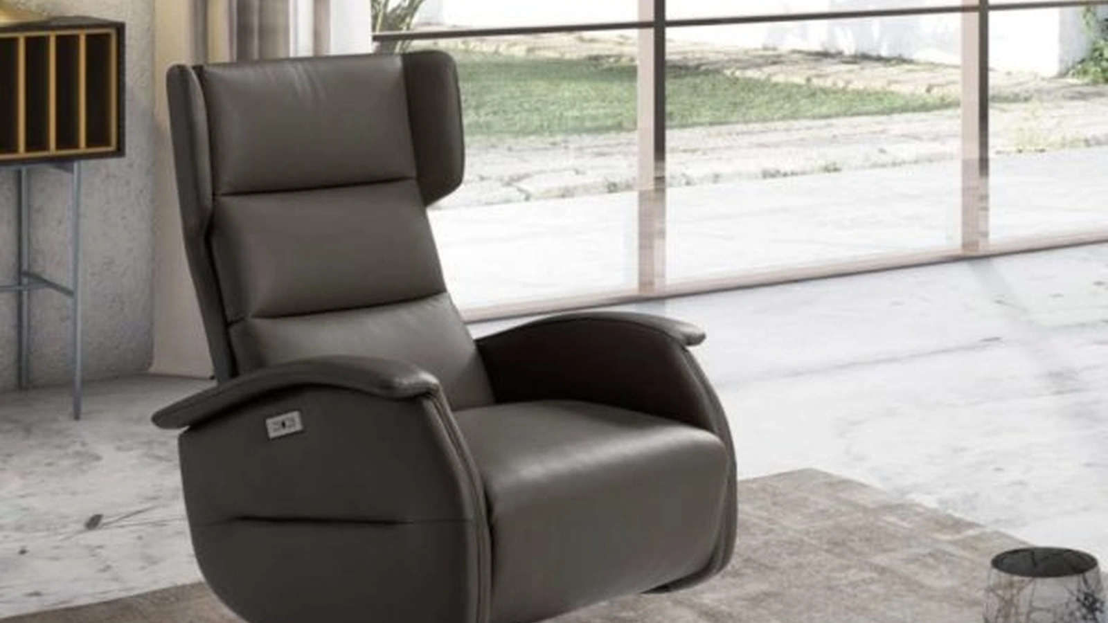 Poltrona relax in ecopelle con base in acciaio Siviglia Swivel di Spaziorelax