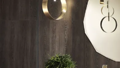 Lampada Led Loop PT da Terra composta da un basamento e da una struttura in metallo verniciato grafite di Riflessi