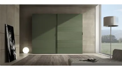 Armadio laccato opaco verde prussia con inserti in cemento Comp 06 di Voltan