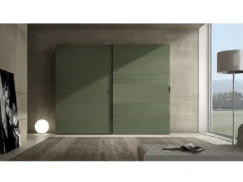 Armadio laccato opaco verde prussia con inserti in cemento Comp 06 di Voltan