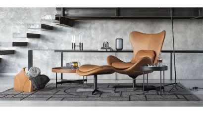 Poltrona in pelle con base in metallo girevole e basculante Relax con pouf Lazy Calligaris